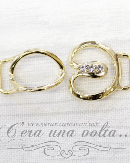 Agganciature per abbigliamento oro con strass