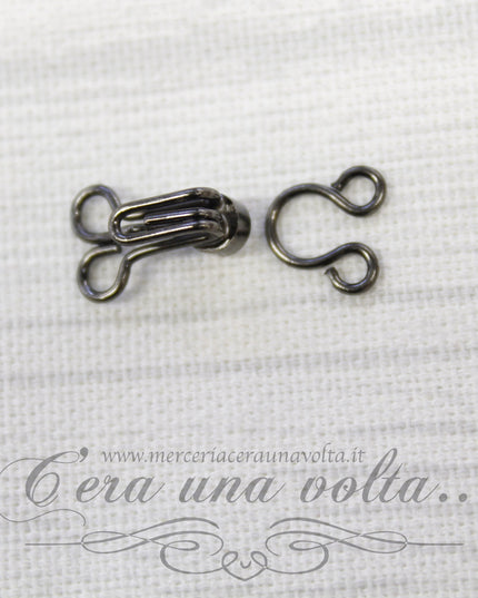 Ganci per abbigliamento con punto luce